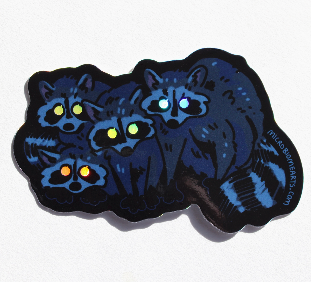 Glowing Eye Raccoons Holo Sticker | Microbiome Arts